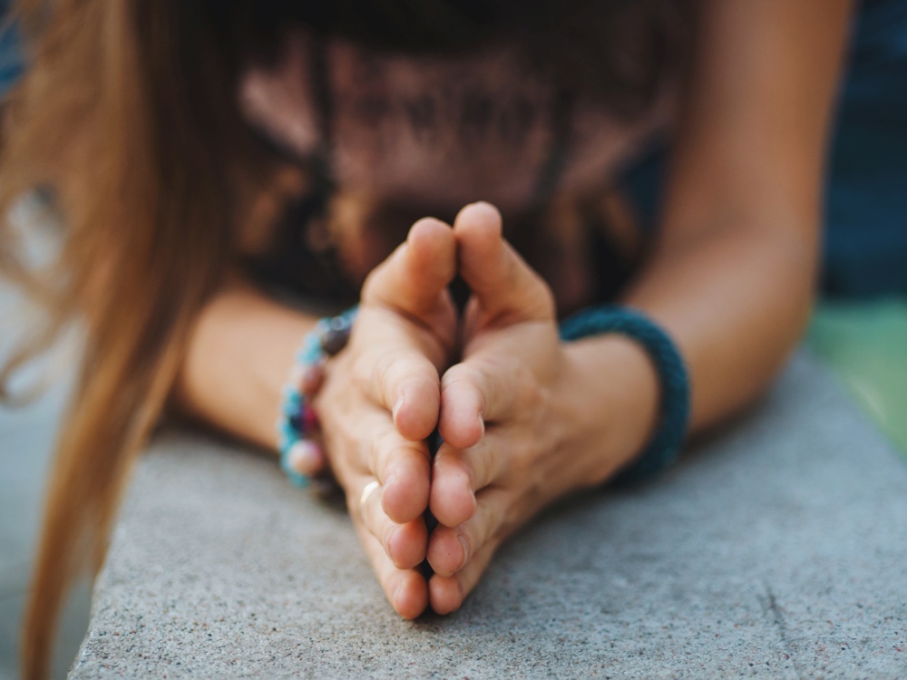 Woman hands together symbolizing prayer and gratitude. Mudra. Yoga concept. High quality photo. Woman hands together symbolizing prayer and gratitude. Mudra. Yoga concept.