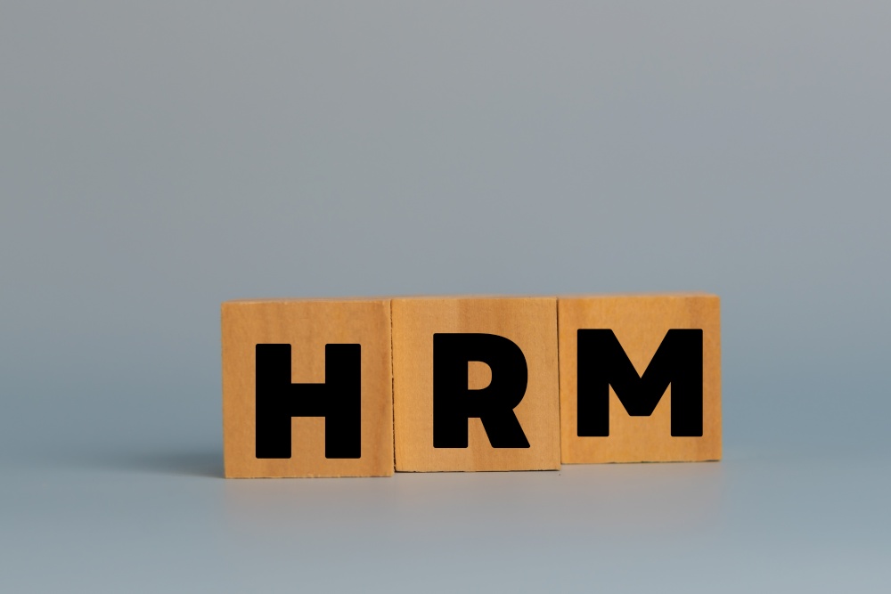 Wood cube HRM human resources management on background.Business strategy skill employee concept.