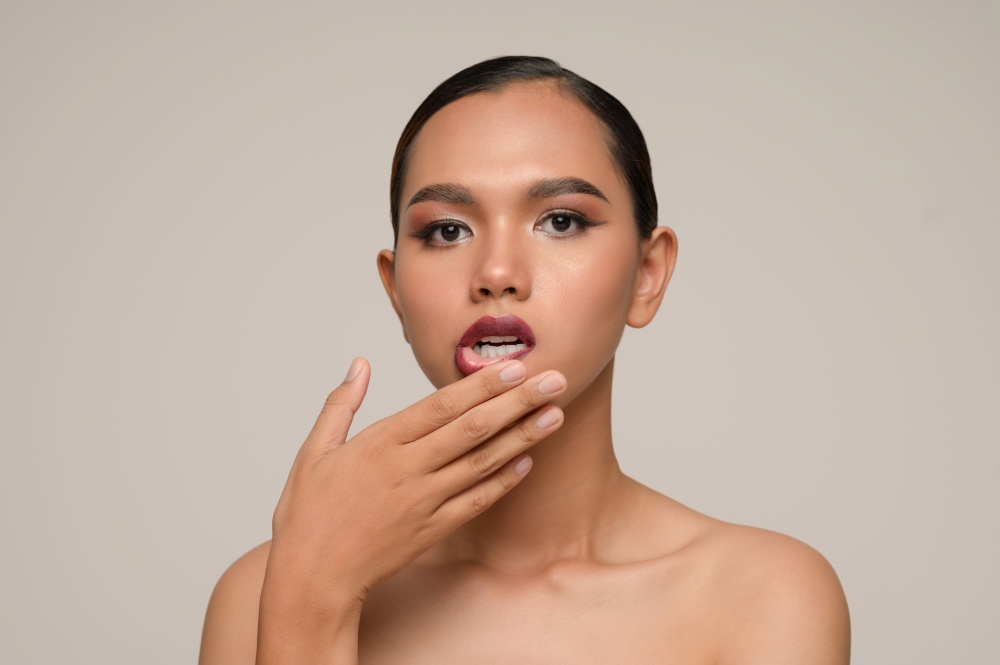 Portrait with manicure hands of beautiful asian woman use finger touch on lips,  beautiful natural clean skin nature make up,  fresh spa female beauty cometic, copy space