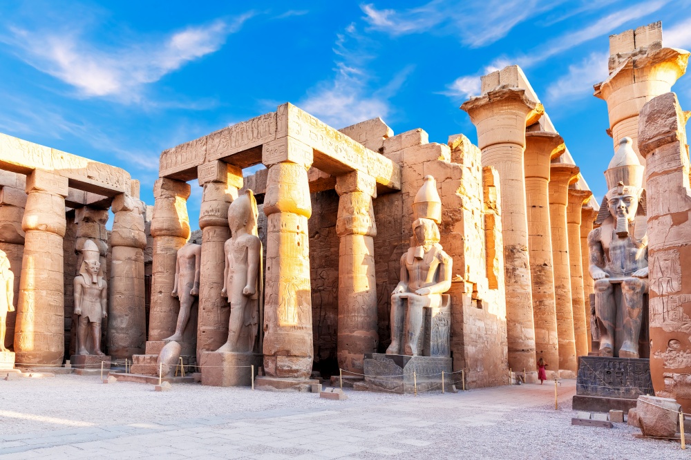Beautiful Luxor temple, first pylon ruins near the statues of Ramses II, Egypt.