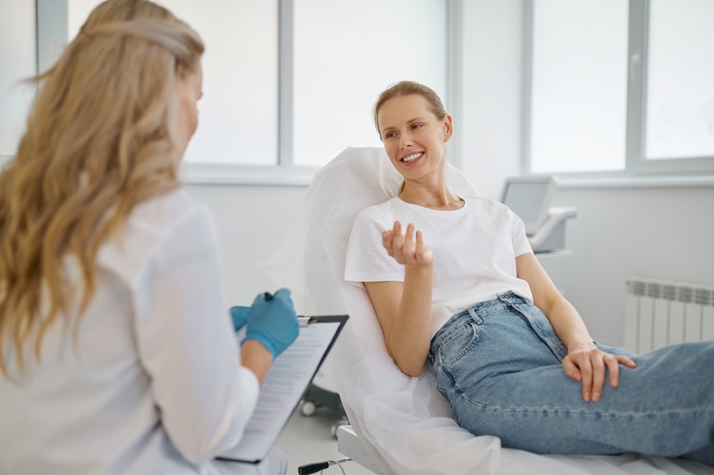 Professional consultation in modern cosmetology clinic. Woman client talking to doctor about skin care and treatment. Professional consultation in modern cosmetology clinic