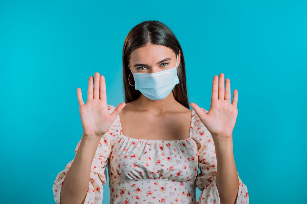 Woman in protective mask shows her hands - it is clean and sterile. Stop virus concept, bacteria protection. Woman in protective mask shows her hands - it is clean and sterile. Stop virus concept, bacteria protection.