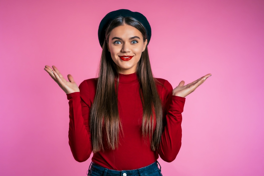 Excited happy woman. Female shocked model on pink background. Pretty woman with perfect make-up, stylish outfit pleasantly surprised.. Excited happy woman. Female shocked model on pink background. Pretty woman