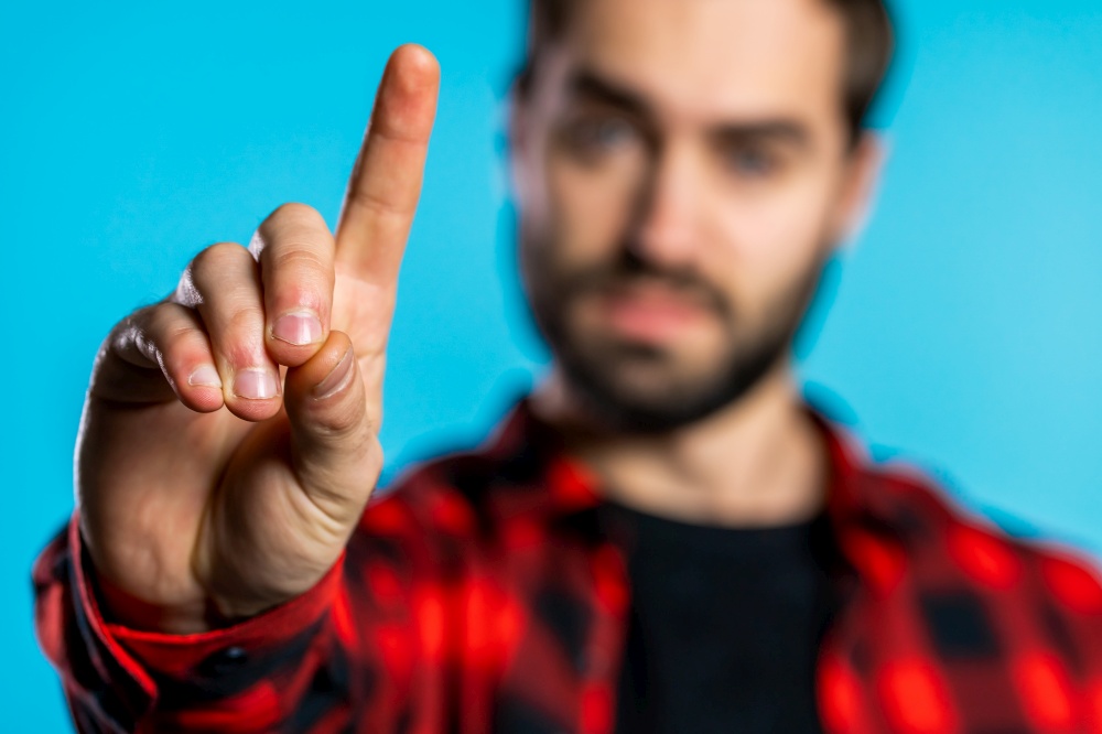 Man disapproving with no hand finger sign make negation finger gesture. Denying, Rejecting, Disagree, Portrait of handsome guy. Man disapproving with no hand finger sign make negation finger gesture. Denying, Rejecting, Disagree, Portrait of handsome guy.