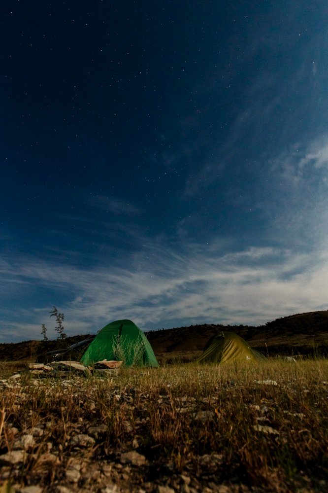 tent for camping on the beach on the background of the Seascape in the night. High quality photo. tent for camping on the beach on the background of the Seascape in the night