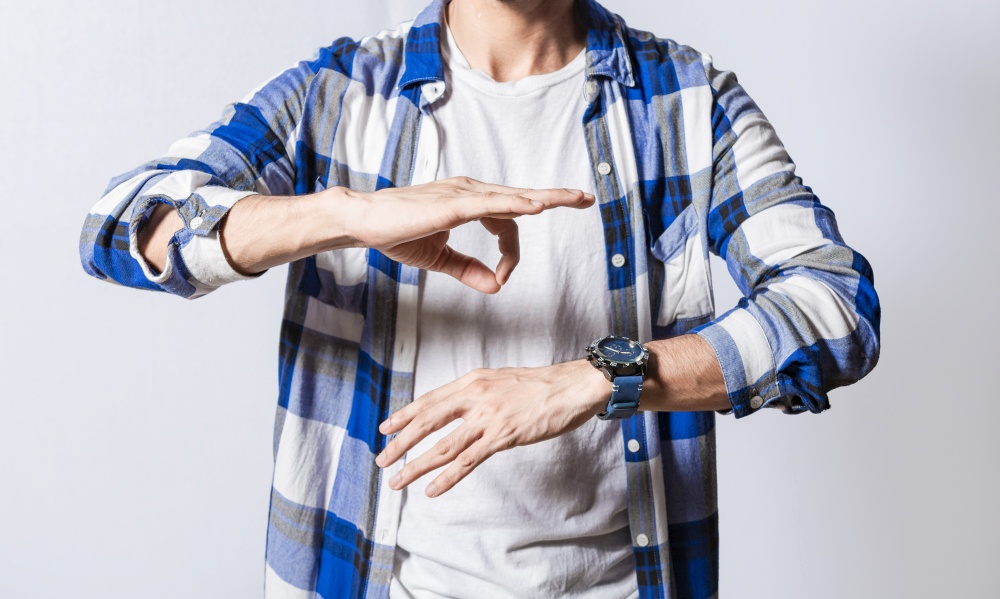 Person speaking in sign language isolated. Young man gesturing in sign language, People who speak in sign language. Manual gestures of people with hearing problems