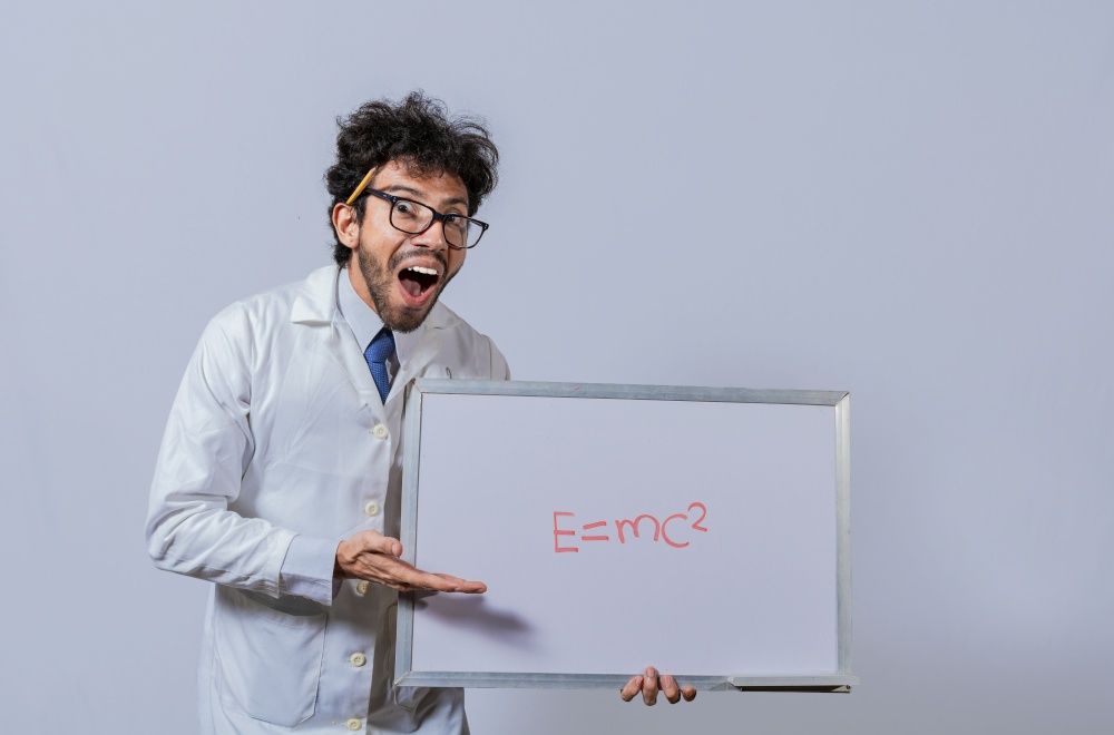Physics professor holding whiteboard with a mathematical formula. Scientist holds and points to a whiteboard with a mathematical formula. Scientist showing blackboard with mathematical equation