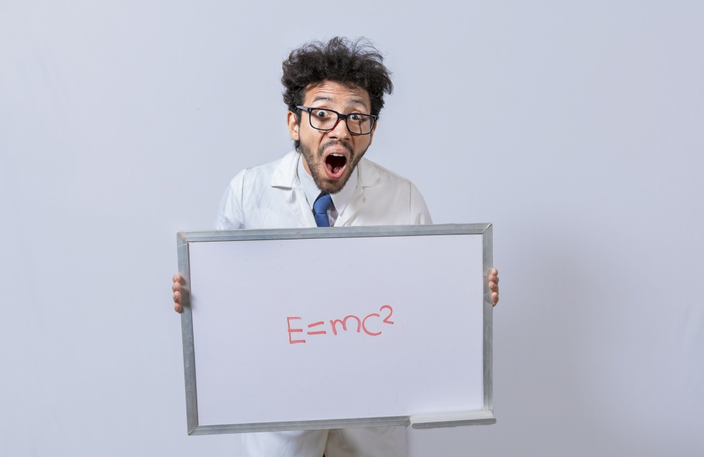 Scientist holds and points to a whiteboard with a mathematical formula. Scientist showing blackboard with mathematical equation, Physics professor holding whiteboard with a mathematical formula