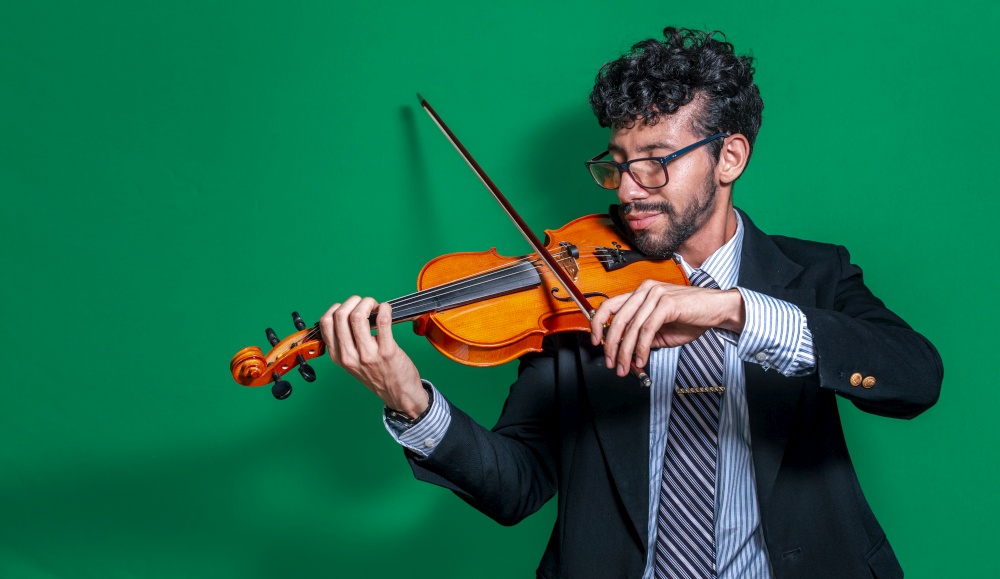Handsome man in formal suit playing violin isolated, Close up of a music teacher playing his violin isolated, Person in suit playing violin on isolated background