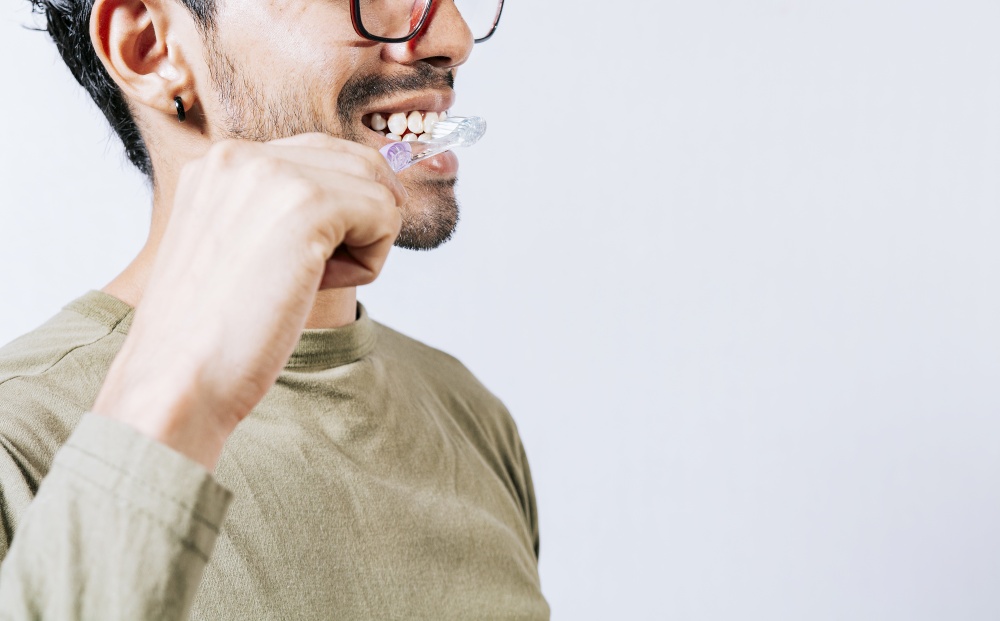 Face of person brushing teeth isolated with copy space. Man brushing his teeth isolated, Face of handsome man brushing his teeth with copy space. Tooth care and brushing concept