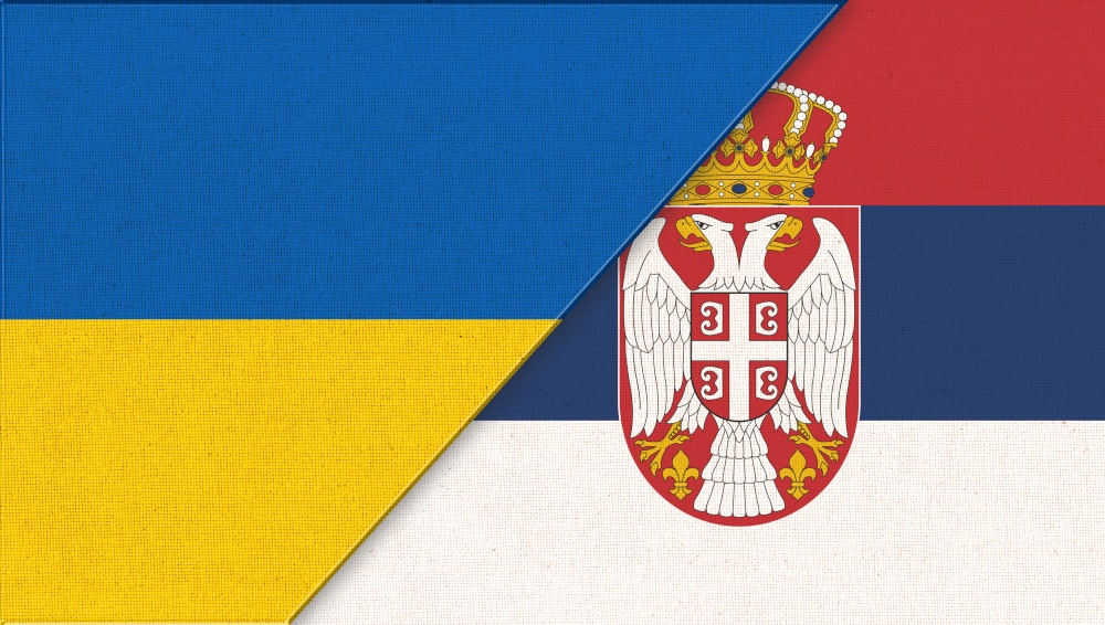 Flag of Ukraine and Serbia. Ukrainian and Serbian flags on fabric texture. Two Flag Together. National Symbols of Ukraine and Serbia. European country. Diplomatic relations. Flag of Ukraine and Serbia. Diplomatic relations. Sport competition
