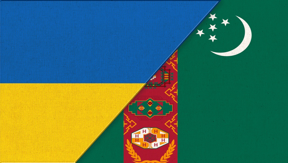 Flag of Ukraine and Turkmenistan. Ukrainian and Turkmen flags on fabric texture. Two Flags Together. National Symbols of Ukraine and Turkmenistan. Diplomatic relations. Turkmen and Ukrainian flags. Flag of Ukraine and Turkmenistan. Ukrainian and Turkmen flags on fabric texture