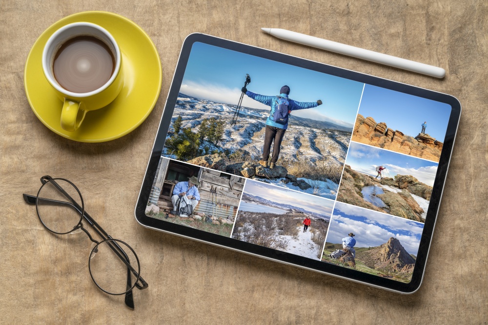 hiking in Rocky Mountains of northern Colorado, reviewing and editing a set of pictures featuring the same senior male hiker, flat lay with coffee and electronic pencil, all images copyright by the photographer