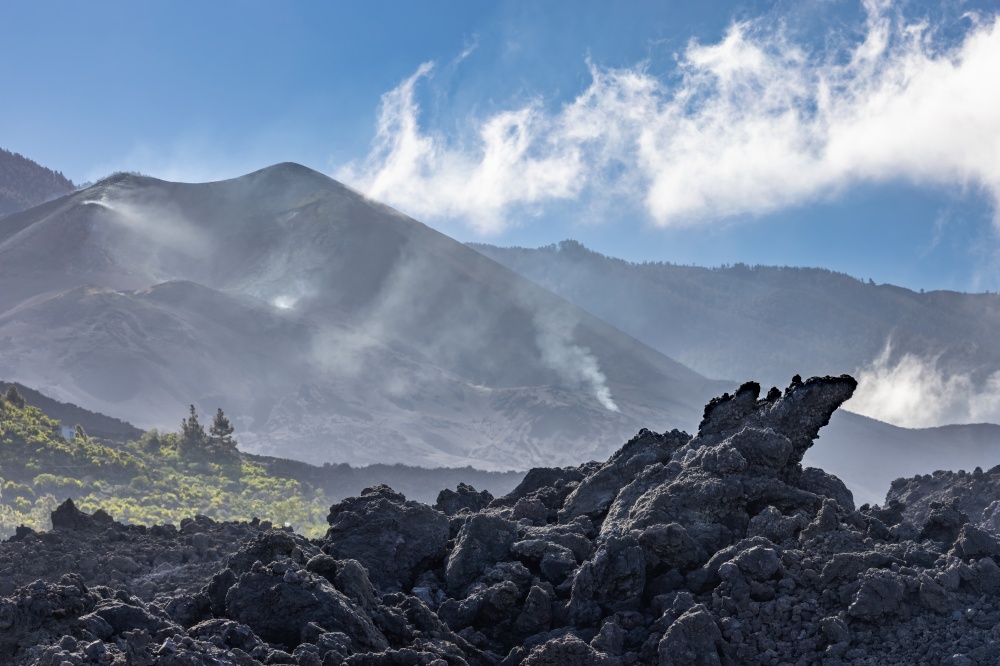 Black rocks of new lava field from recent erupted volcano Cumbre Vieja at la Palma. New lava field from volcano Cumbre Vieja at la Palma