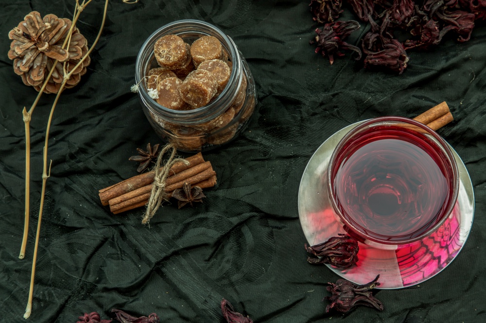 Roselle tea (Jamaica sorrel, Rozelle or hibiscus sabdariffa ) with dry roselle and brown cane sugar cube. Healthy herbal tea rich in vitamin C and minerals. The concept of health. Organic and Summer drink, Drinks & Beverages, No focus, specifically.