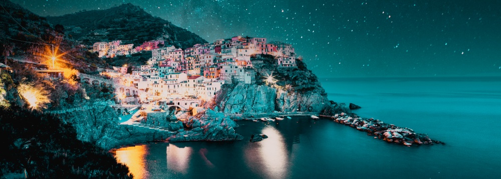 starry night over  Manarola village one of Cinque Terre at night in La Spezia, Italy