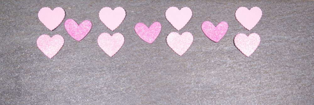 gray granite background with pink and white hearts for valentines day. Valentine&rsquo;s day and love concept.. gray granite background with pink and white hearts for valentines day. Valentine&rsquo;s day and love concept