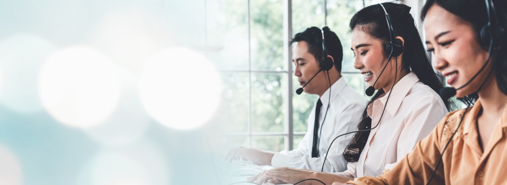 Business team wearing headset working actively in office . Call center, telemarketing, customer support agent provide service on telephone video conference call.. C1-C2-C3