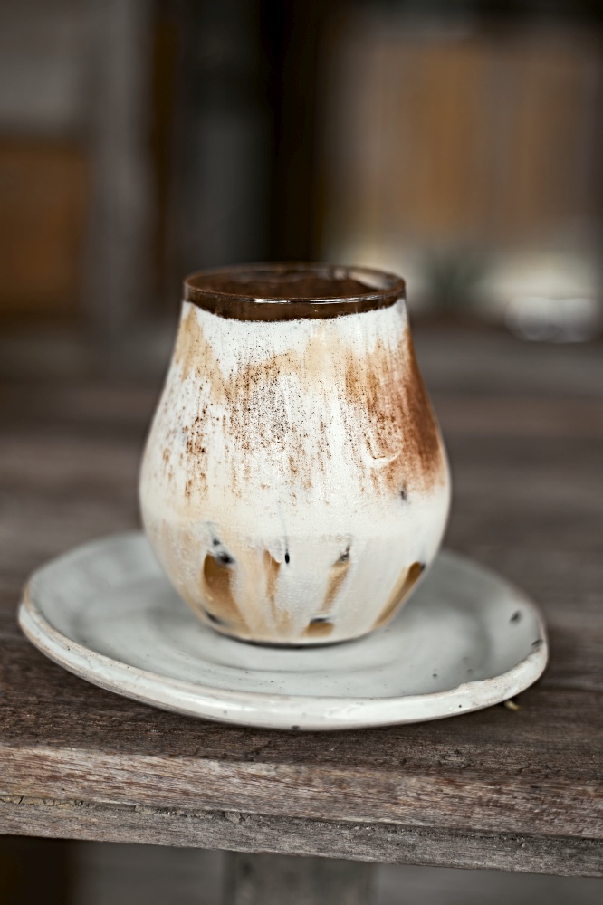 Iced coffee vanilla latte with milk foam.selective focus. Iced coffee vanilla latte with milk foam.