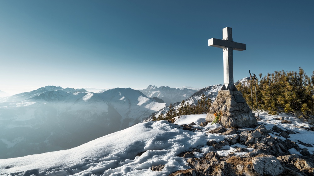 The cross on top of a mountain in the Italian Alps