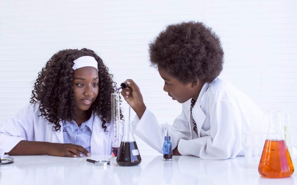 African black students studying science in classroom at school. Education and Diversity Concept.