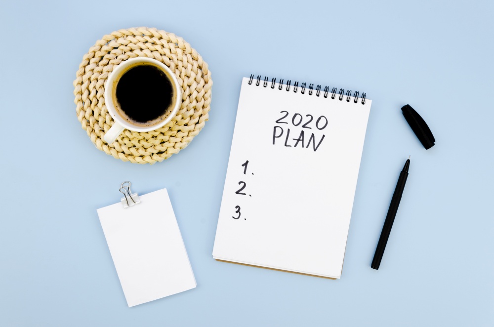 top view 2020 resolutions plan with cup coffee