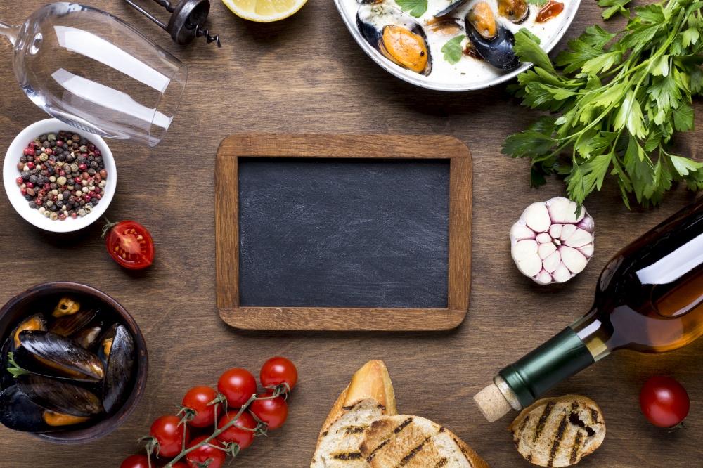flat lay mediterranean diet with mussels with blackboard