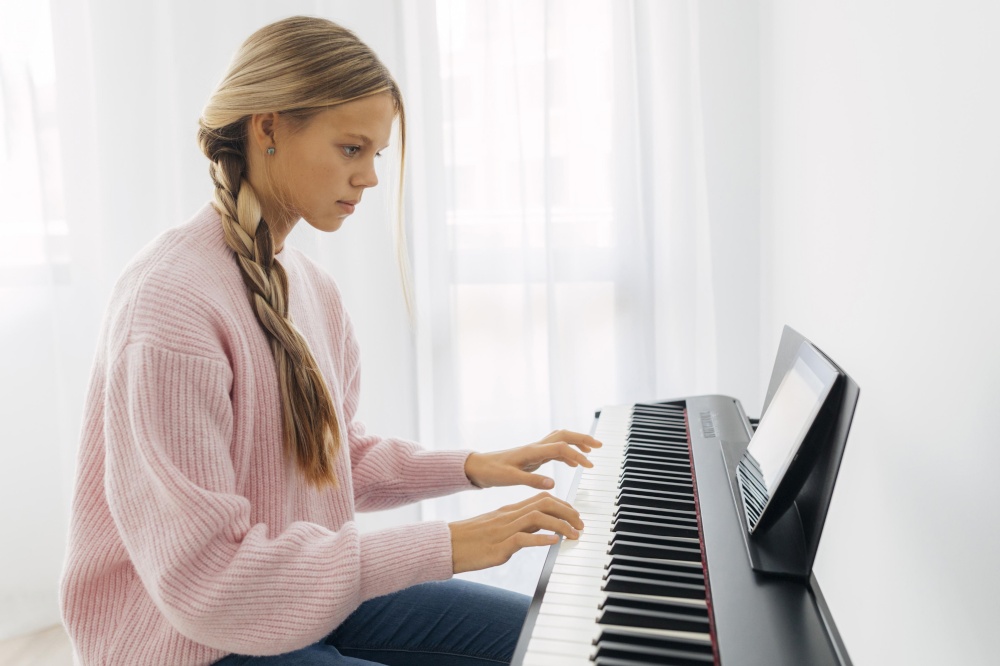 young girl playing keyboard instrument 2