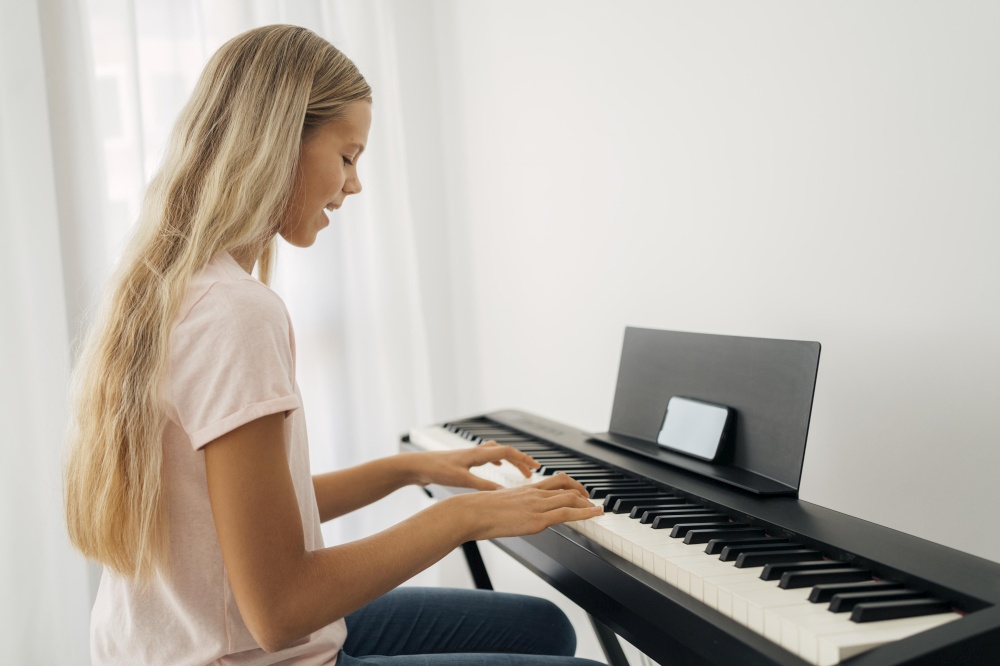 young girl playing keyboard instrument home 2