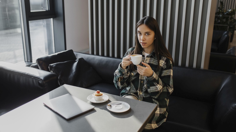 young woman enjoying coffee break 3