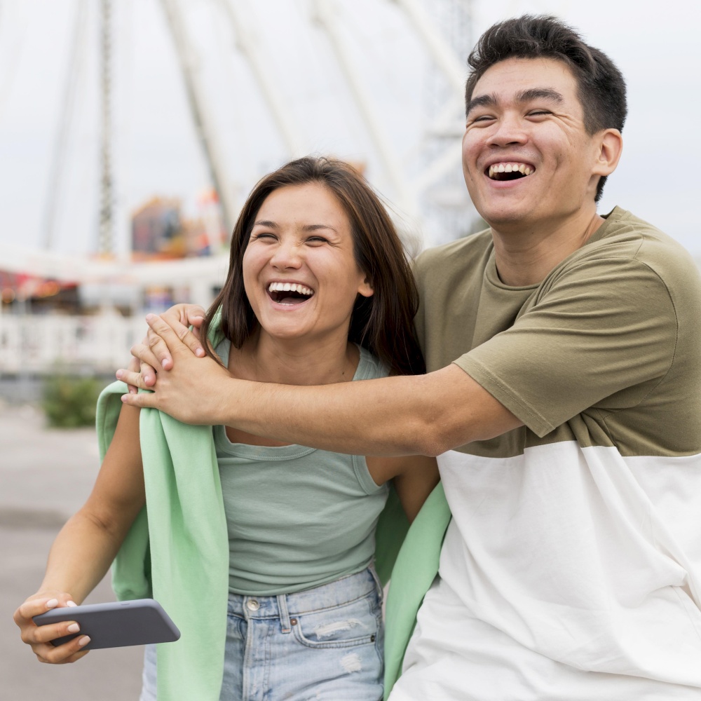 smiley couple embraced outdoors