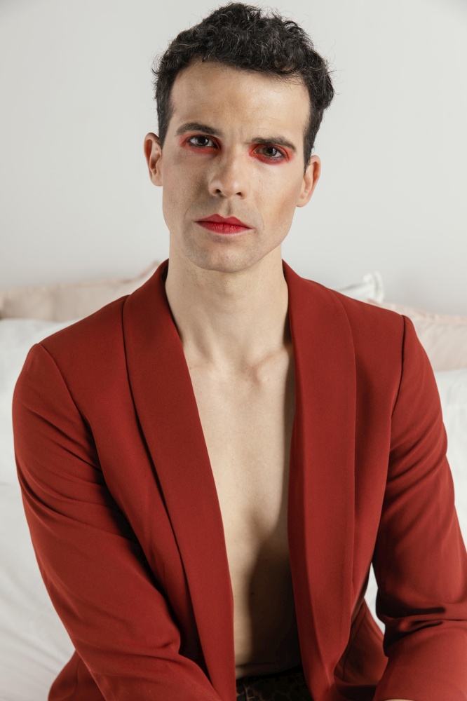 portrait transgender person wearing red jacket