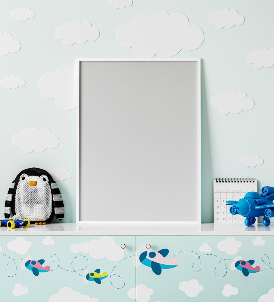 poster frame mock up in children&rsquo;s room with light blue wall with clouds, chest of drawers with planes print, penguin soft toy, plane toy, 3d rendering