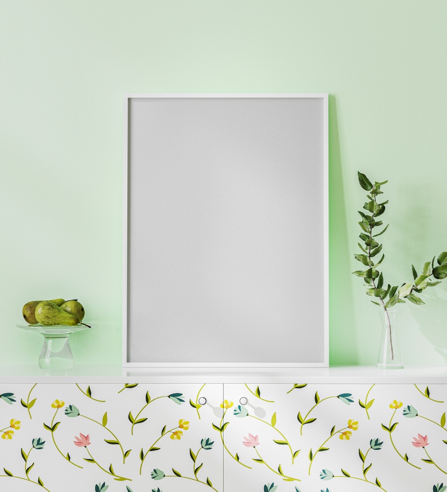 Blank poster frame mock up on the white desk with light green wall, bright interior with floral print, plant in vase and fruits, 3d rendering