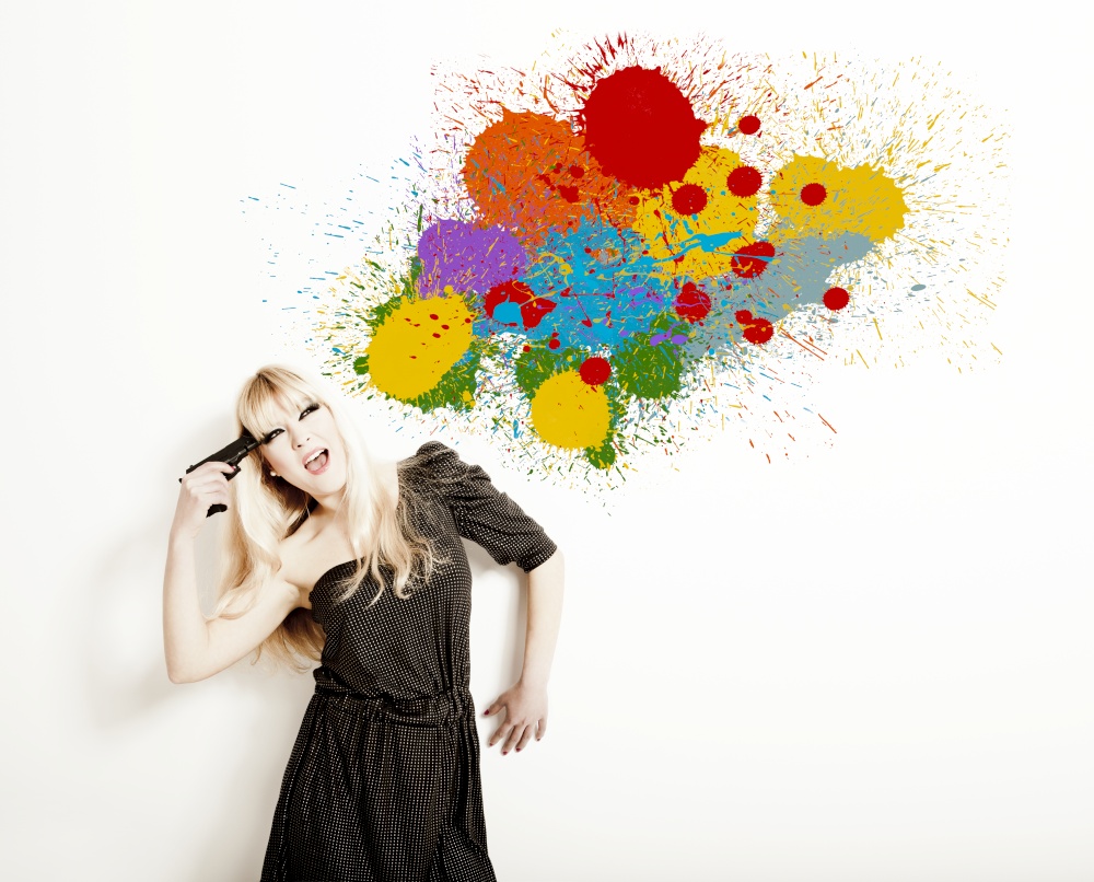 Portrait of a beautiful blonde woman commiting suicide with a splash of paint on the wall