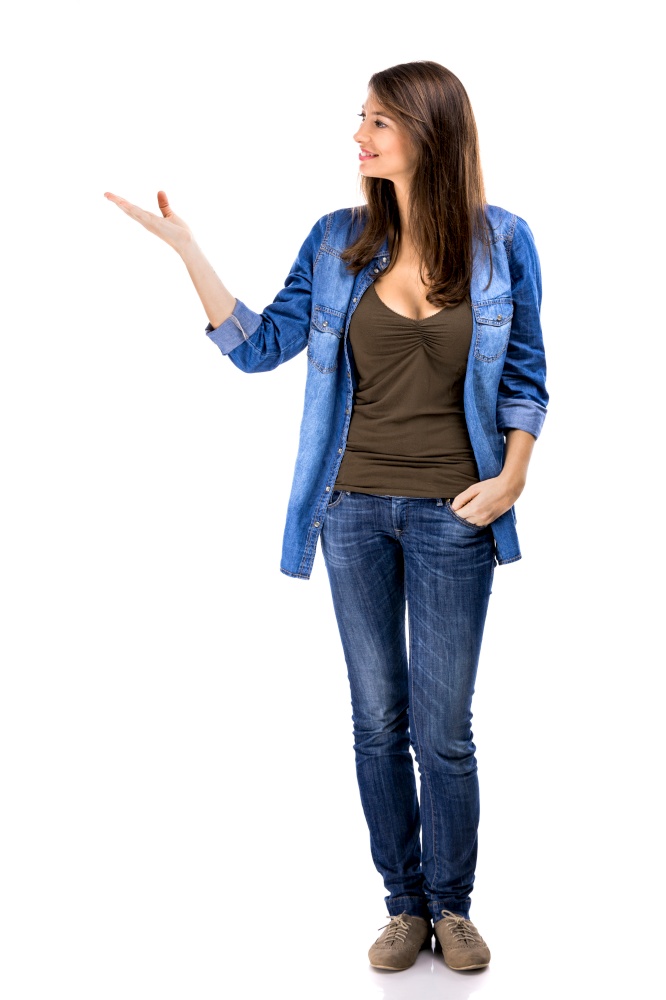 Beautiful woman standing over a white background and talking with someone. Woman talking