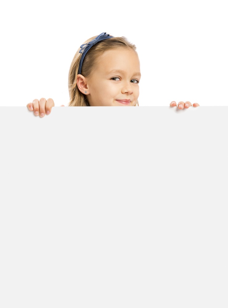 Beautiful little girl holding and showing something on a whiteboard