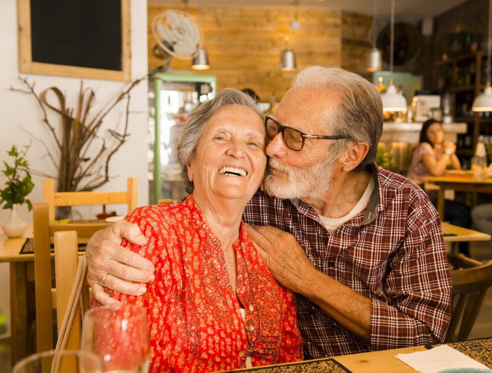 Old couple at the restaurant and  having a good time