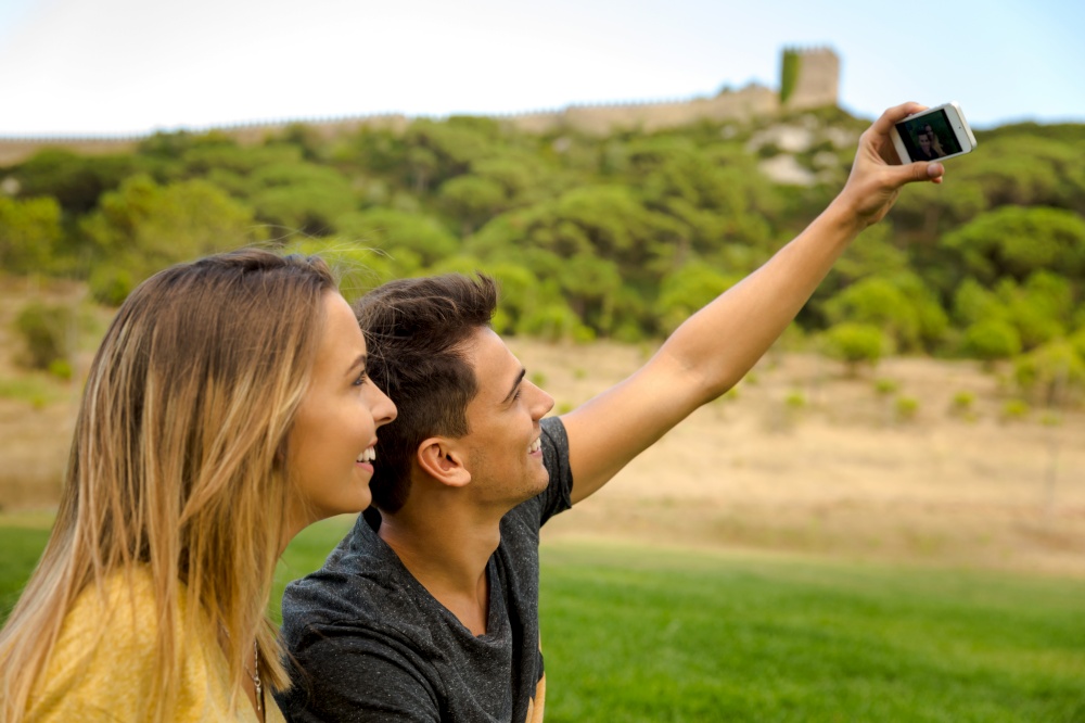 Young beautiful couple making a selfie