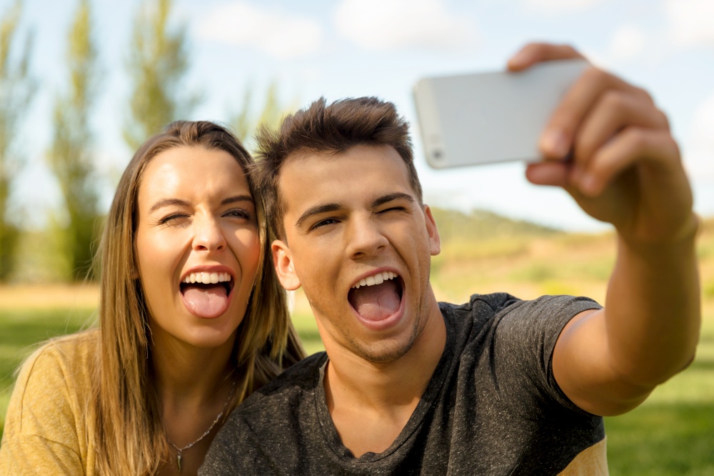 Young beautiful couple making a selfie
