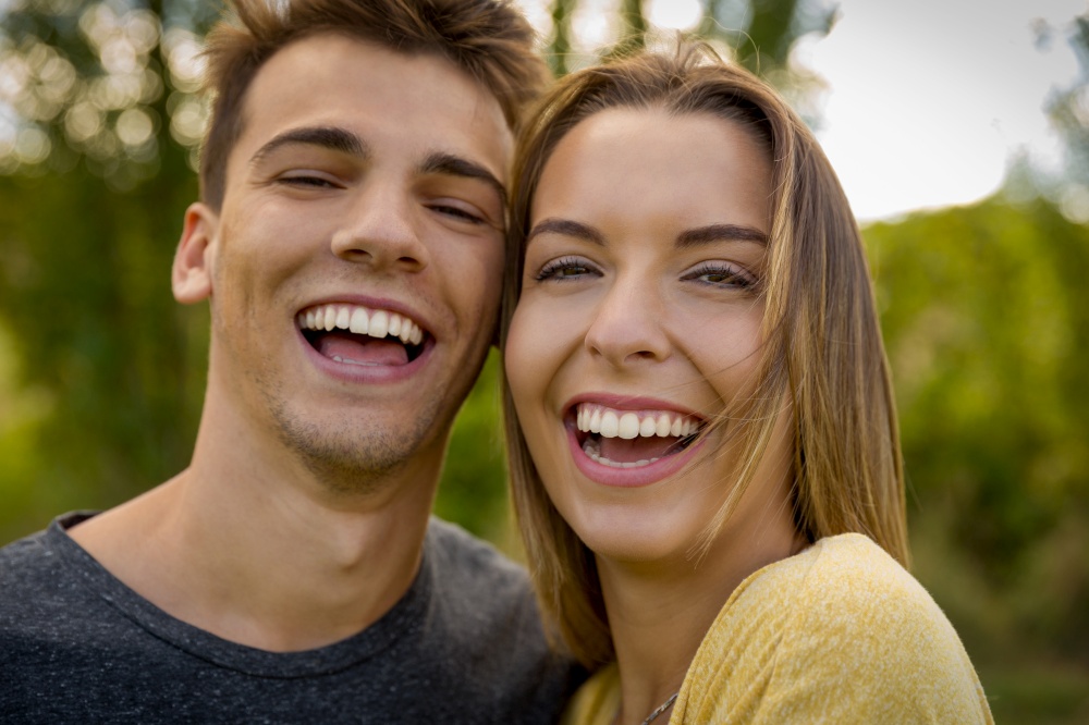 Portrait of a young beautiful couple laughing