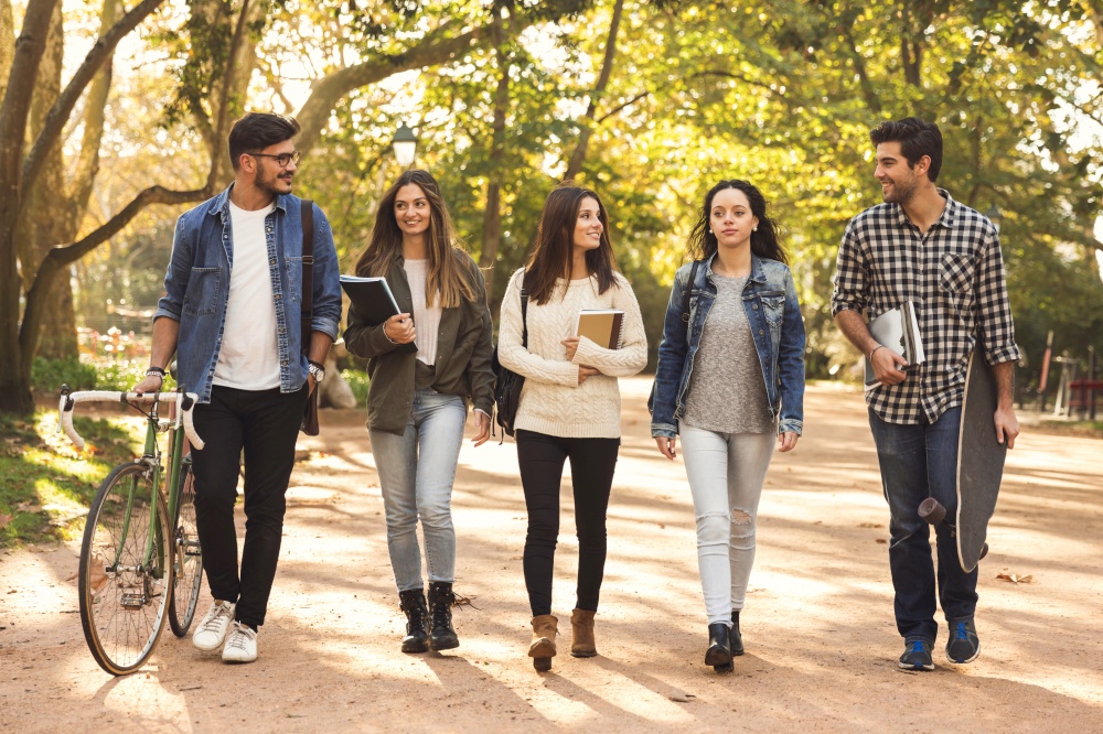 Group of students walking together in the park