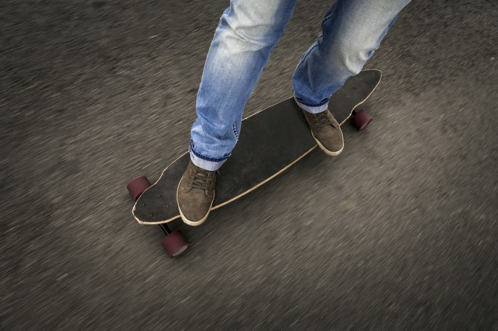 Detail of a young man feet riding a skateboard