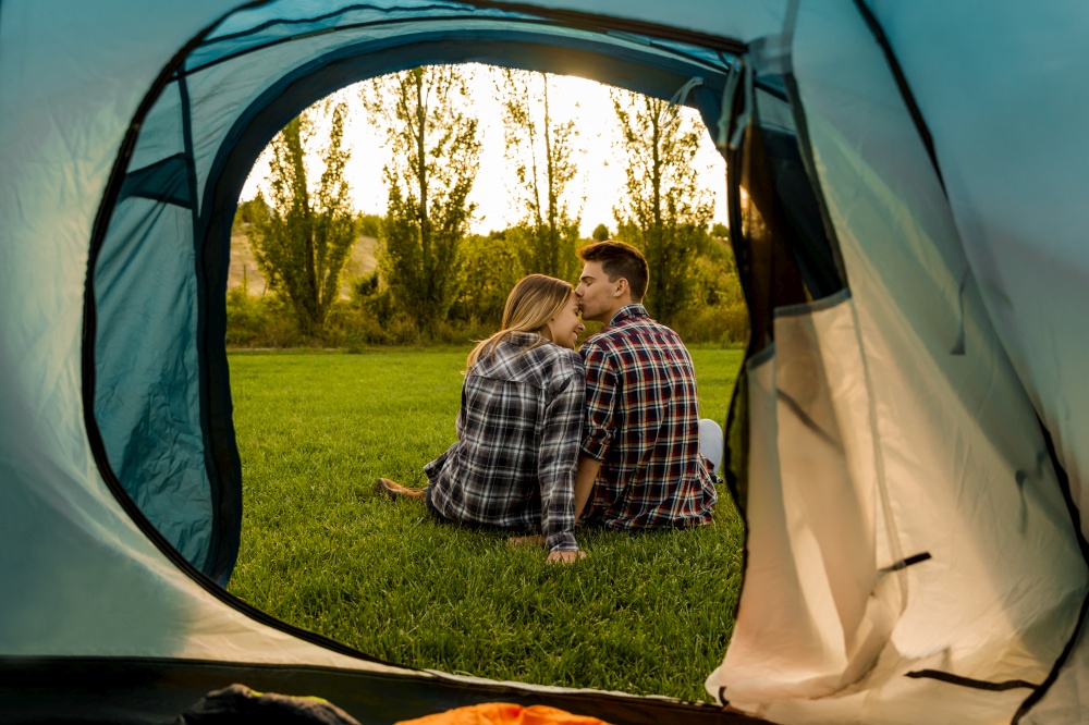 Shot of a happy couple camping on the nature