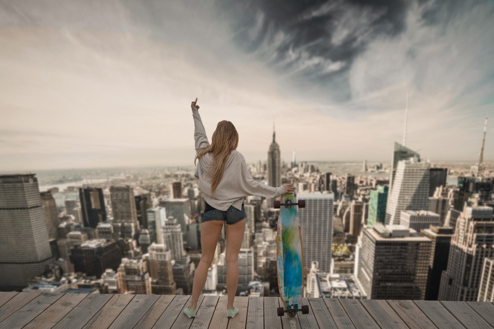 Skater girl on the top of a builduing in NYC