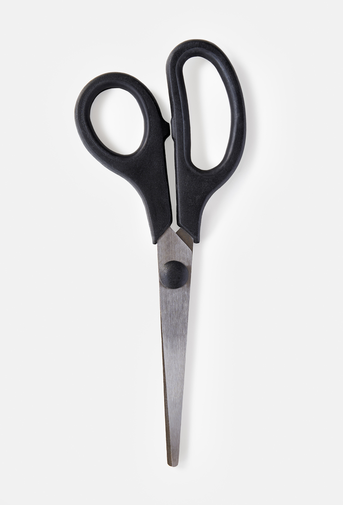 Overhead view of a pair of scissors on a white background