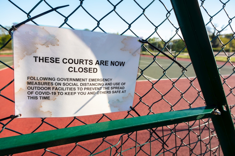 Tennis Courts Closed Sign Due to Coronavirus COVID-19 Pandemic
