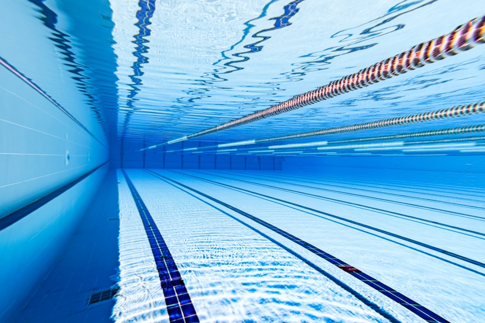 Olympic Swimming pool underwater background.