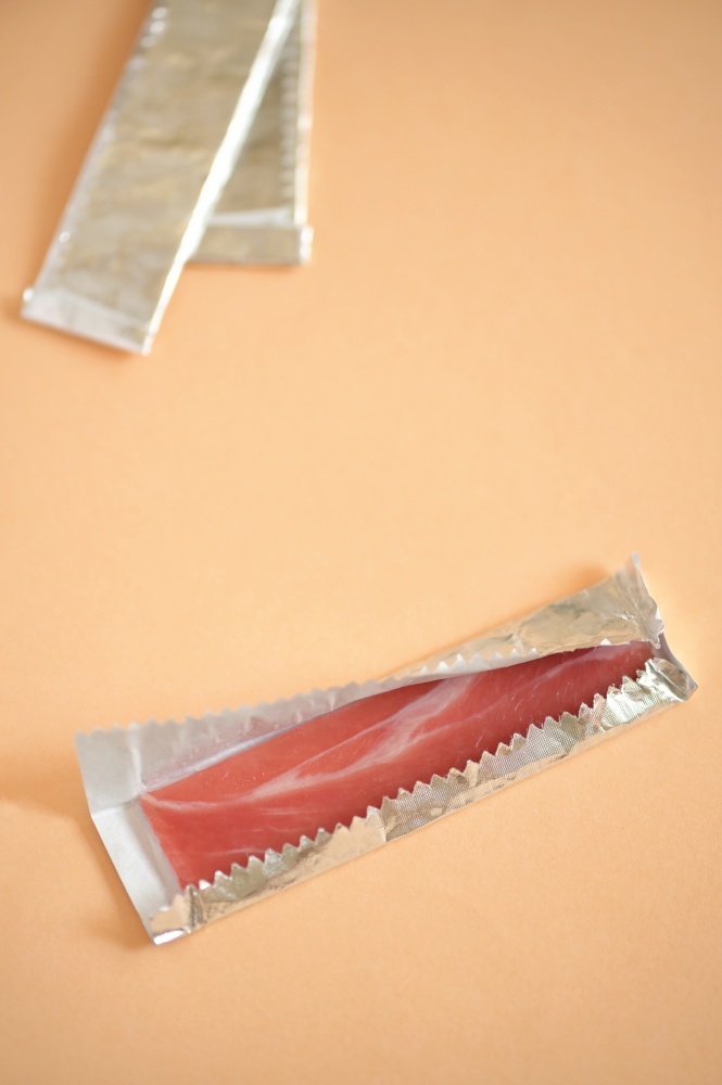 Abstract Chewing Gum Bacon In A Foil Wrapper
