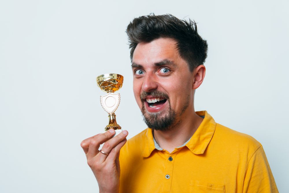 man with a golden cup